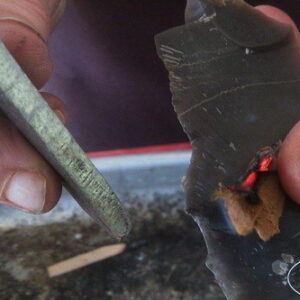 A PERFECT PIC Fire lighting with Beaver Bushcraft holding the amadou and ember